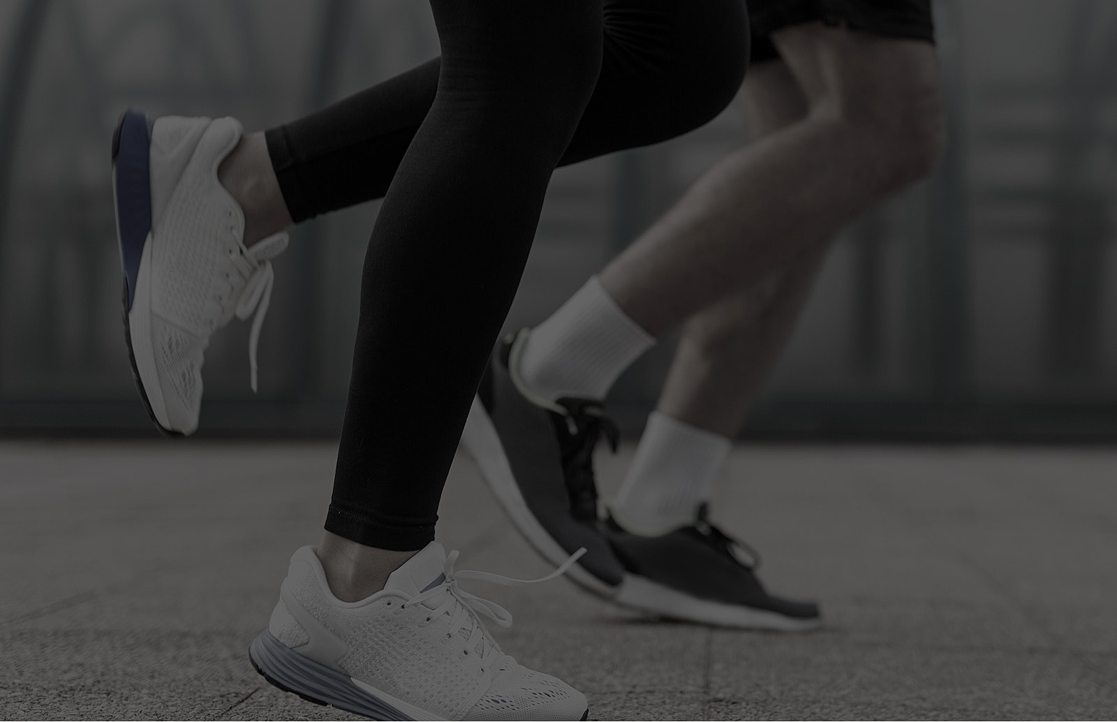 People jogging in athletic shoes.