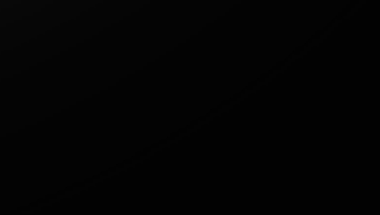 Solid black background with subtle texture.