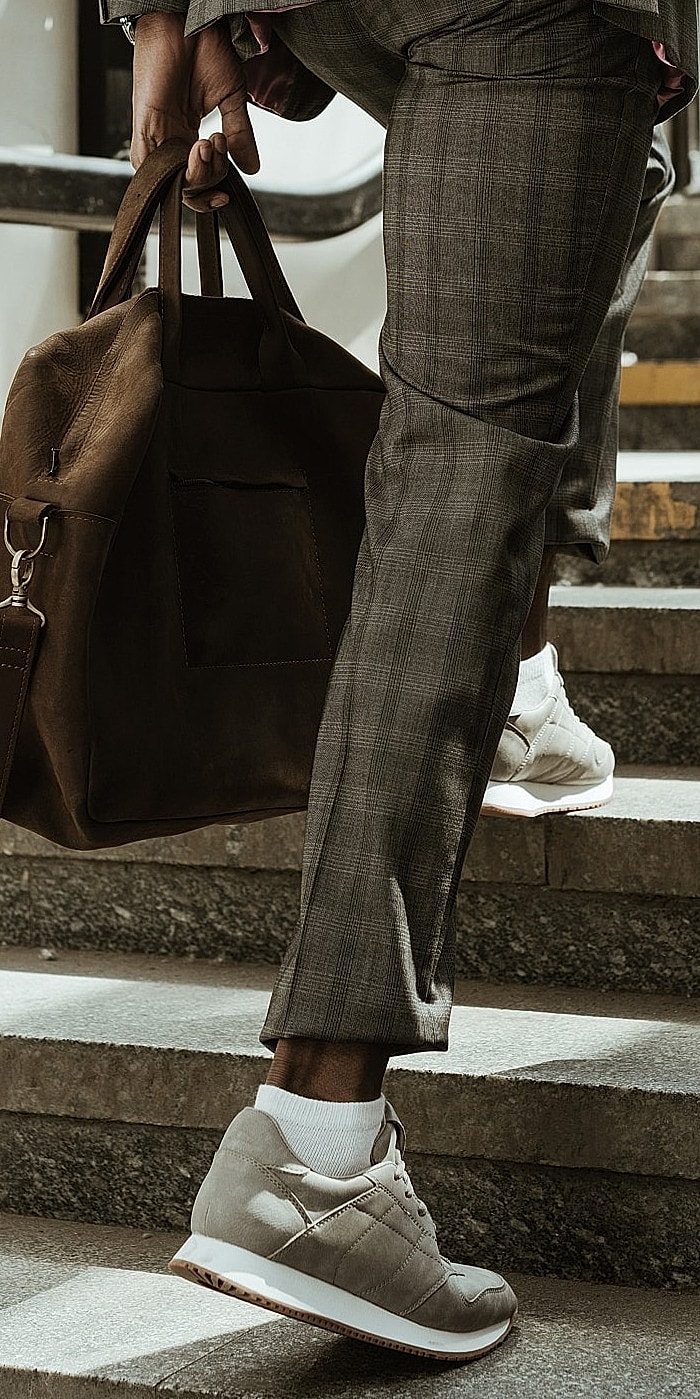 Smiling woman with wavy hair and blue eyes.
