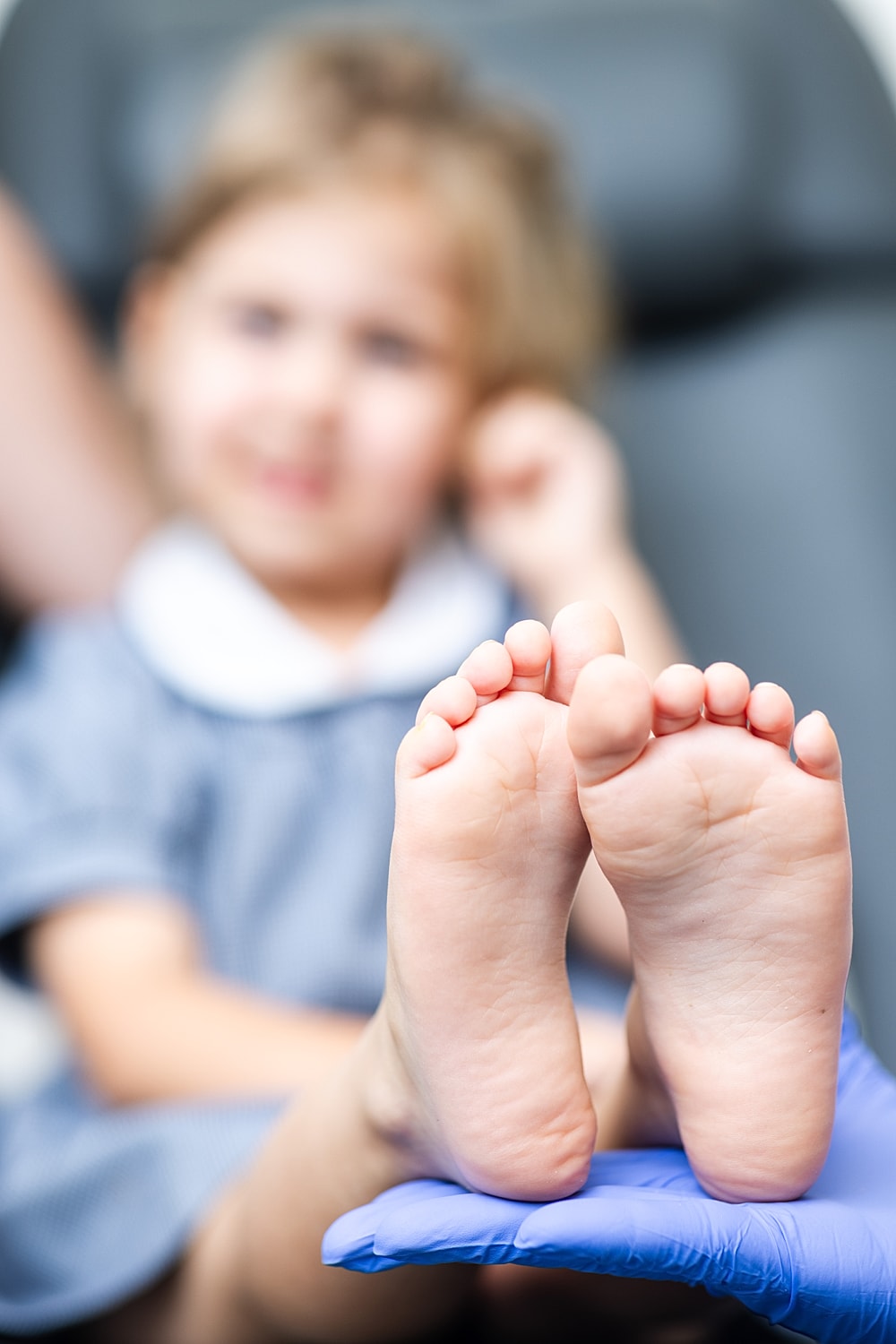Baby feet on a soft blanket.
