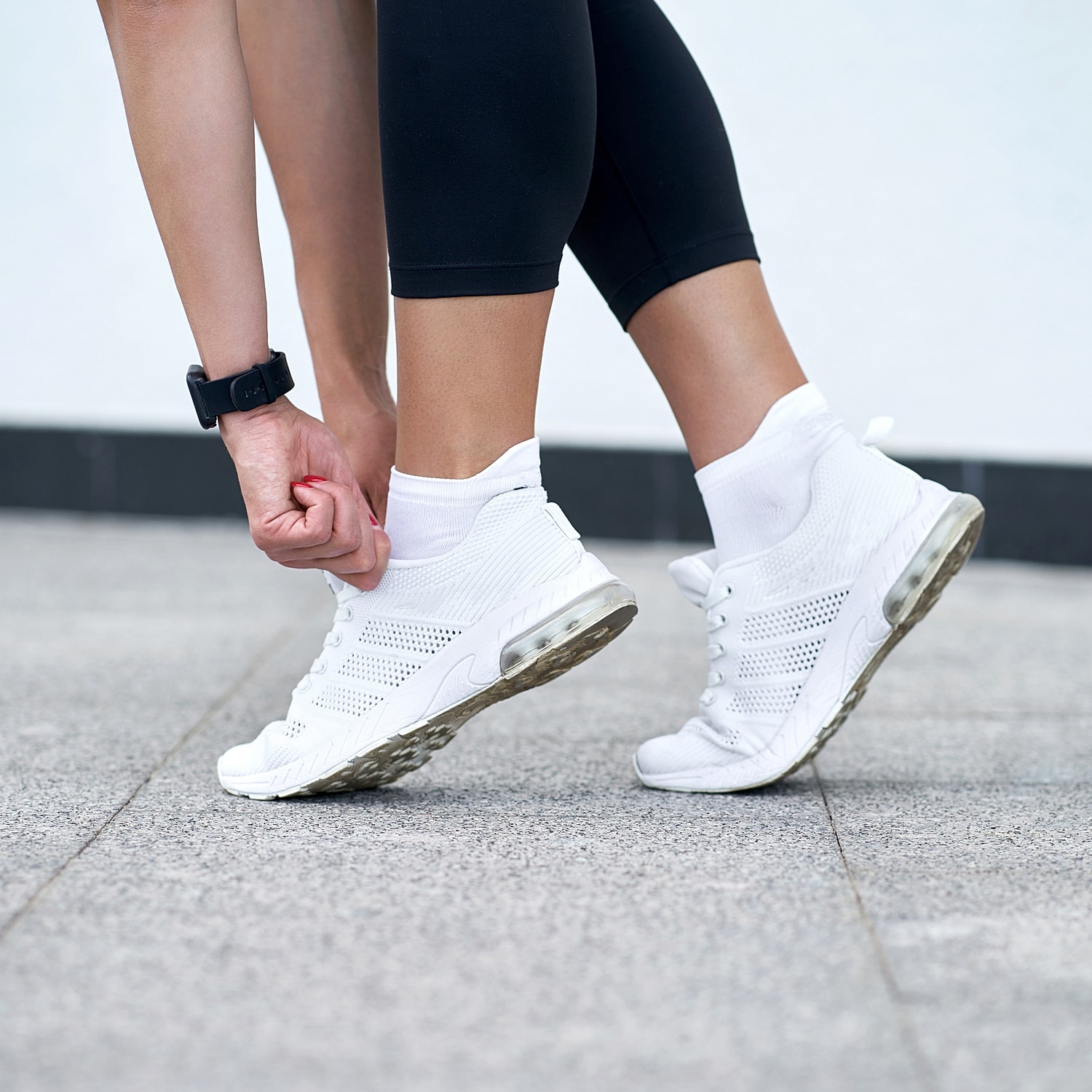 Relaxing feet by a swimming pool.