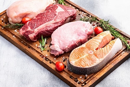 Stylish outfit featuring black heels and handbag.