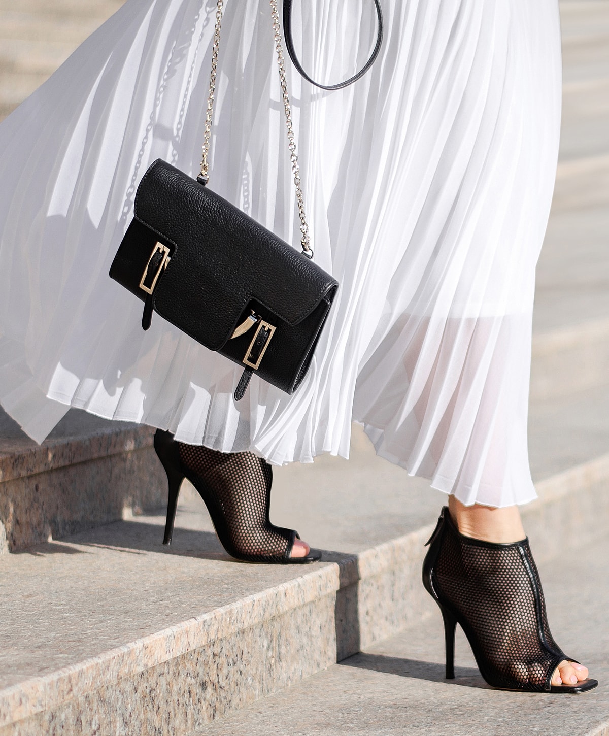 Woman in leopard print dress and high heels.