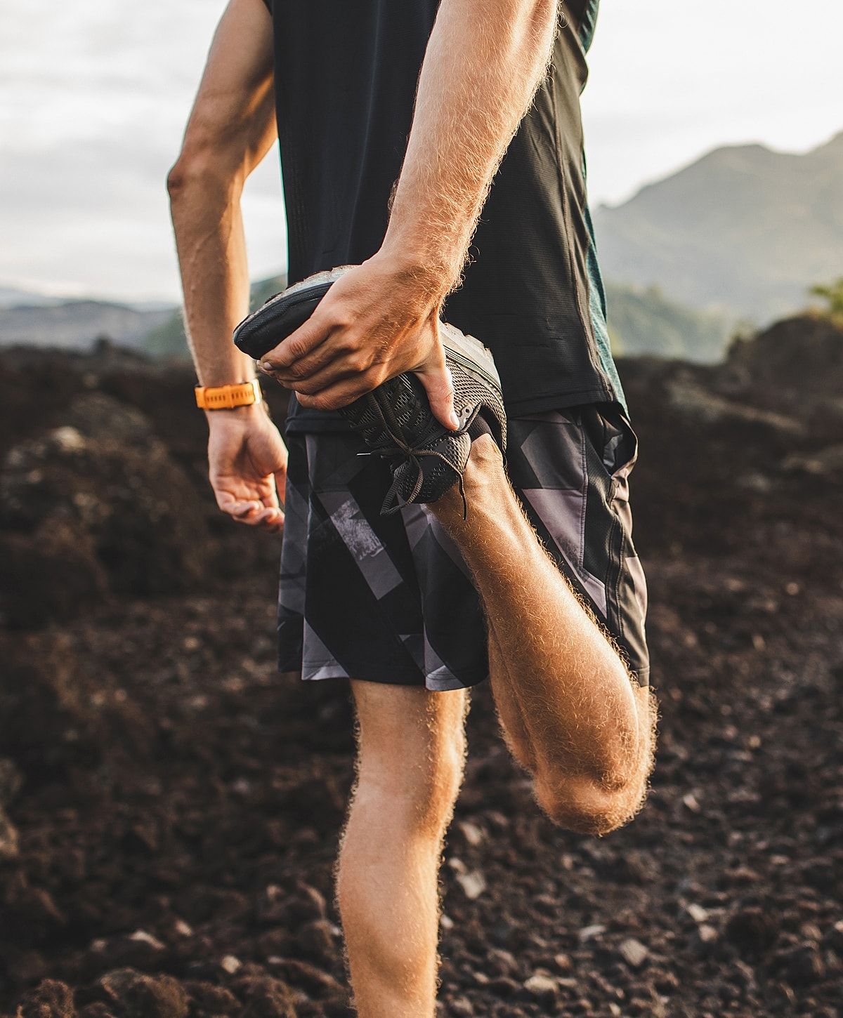 Person sitting with documents on a rug.
