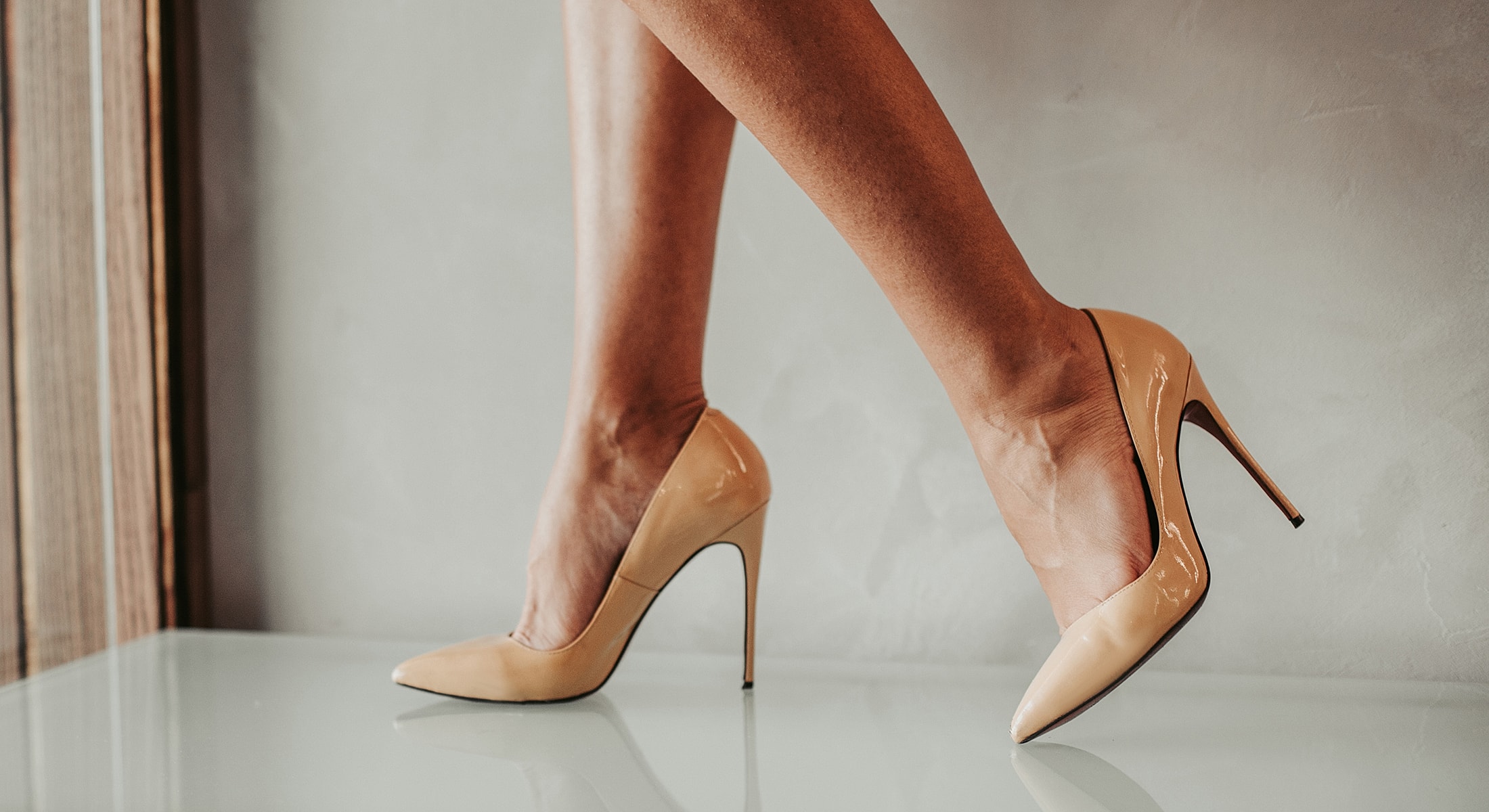 Elegant high-heeled shoes on model's feet.