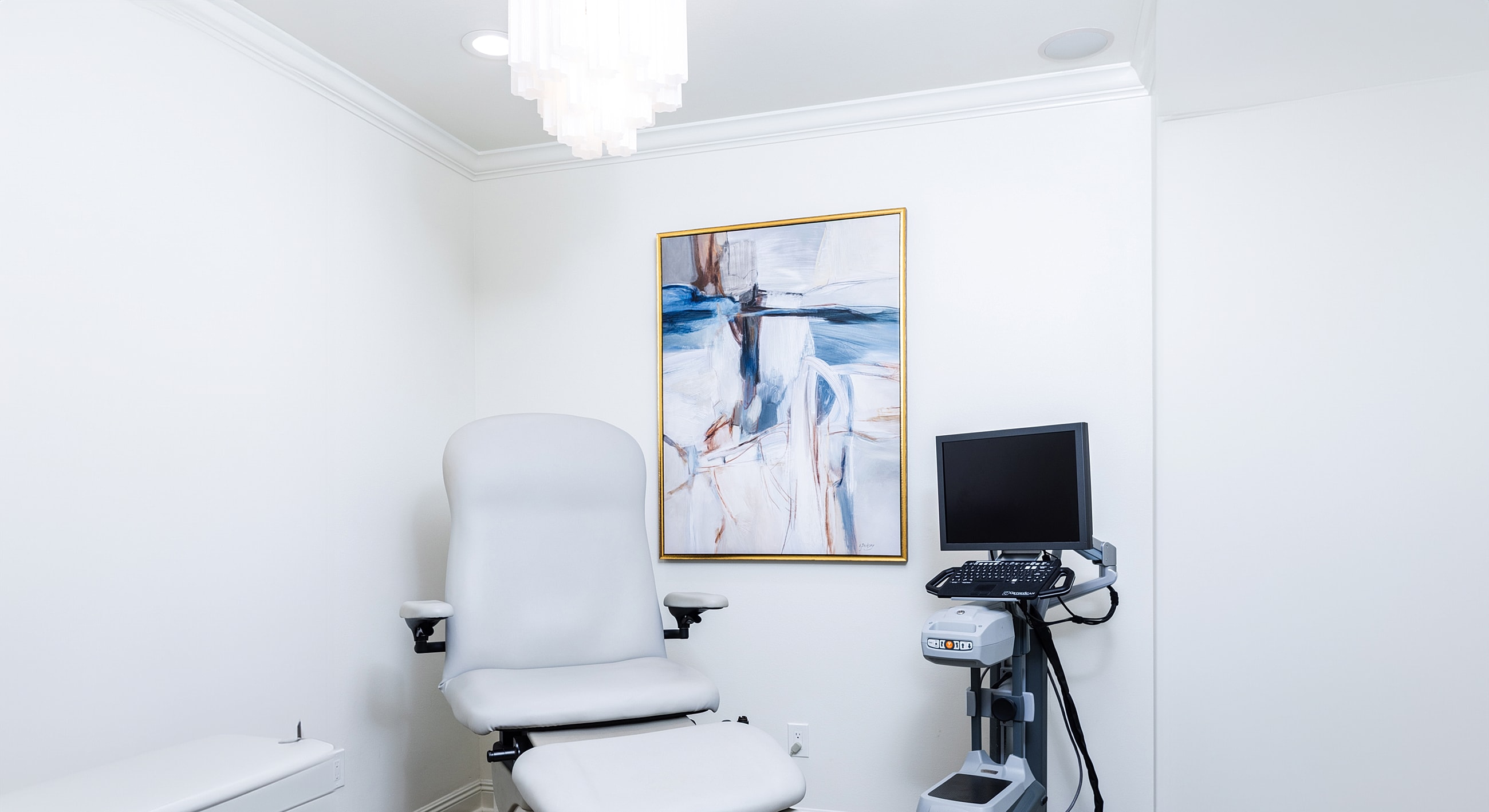 Black high-heeled sandals on a sidewalk.