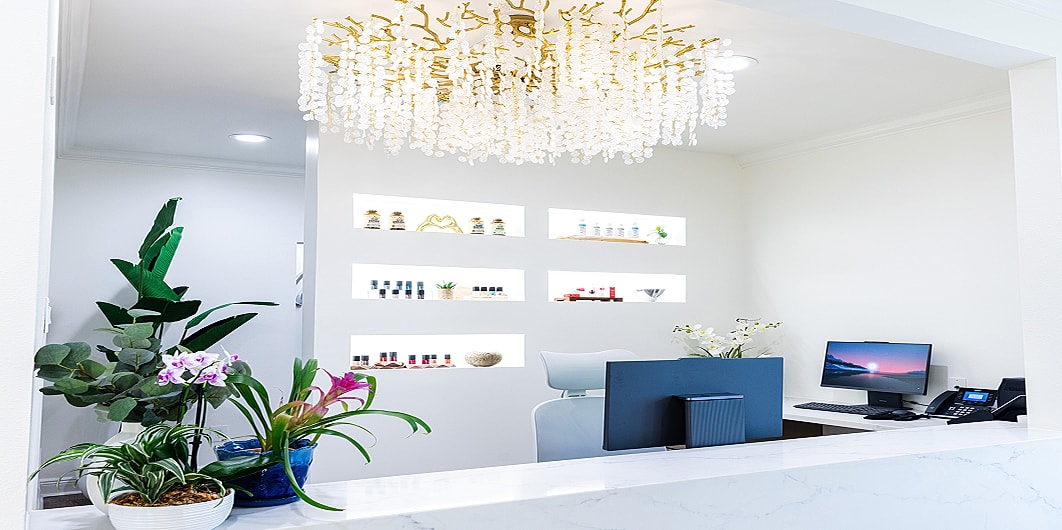 Three women smiling in matching green t-shirts.