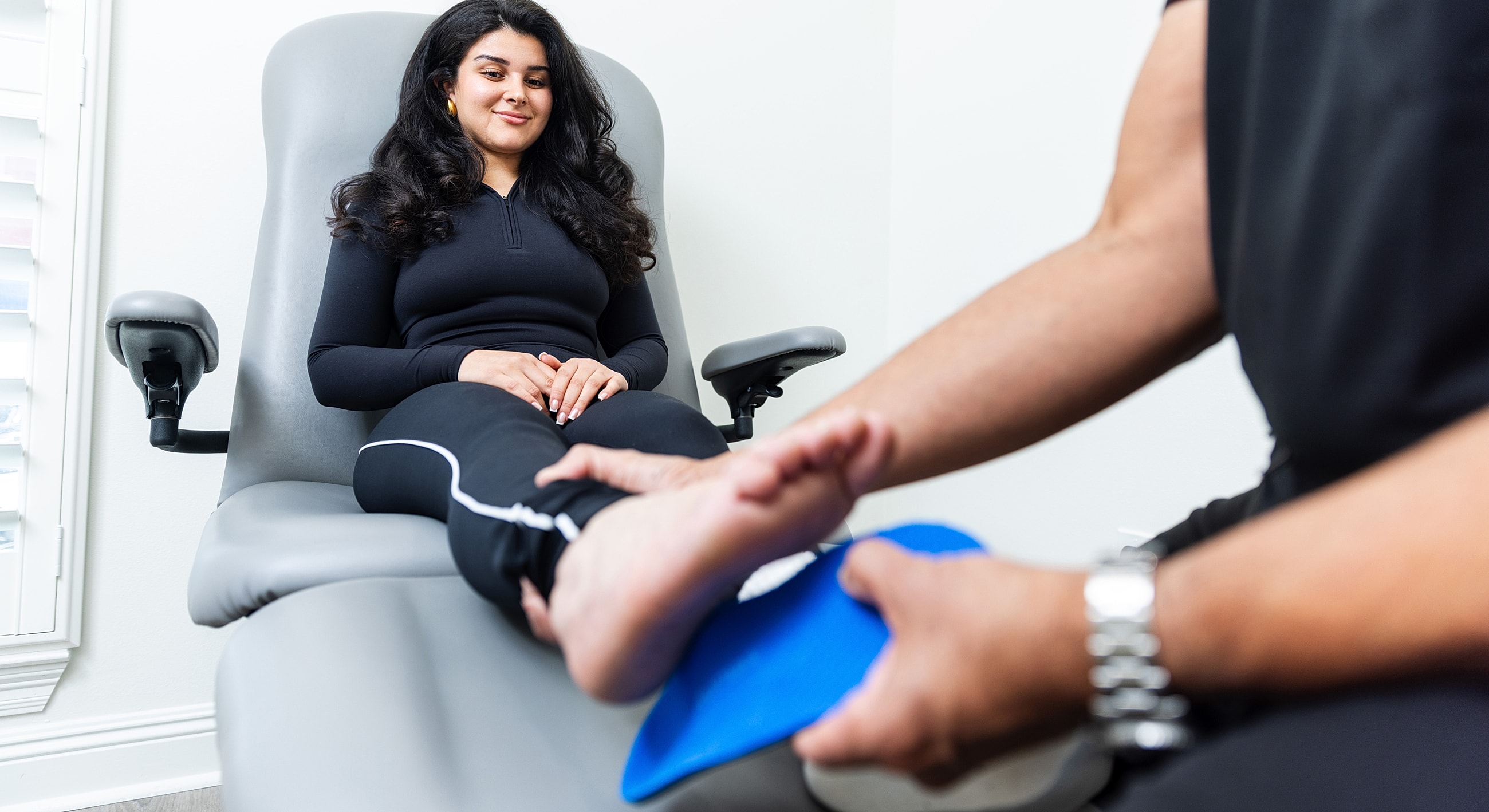 Person climbing stairs in stylish dress shoes.