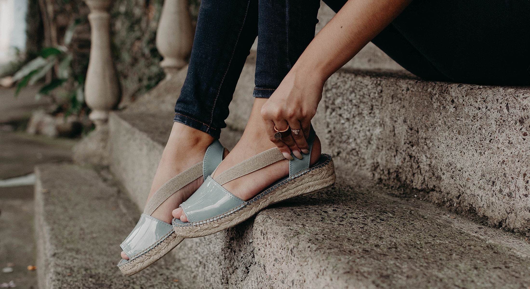 Espadrille sandals on a concrete step.