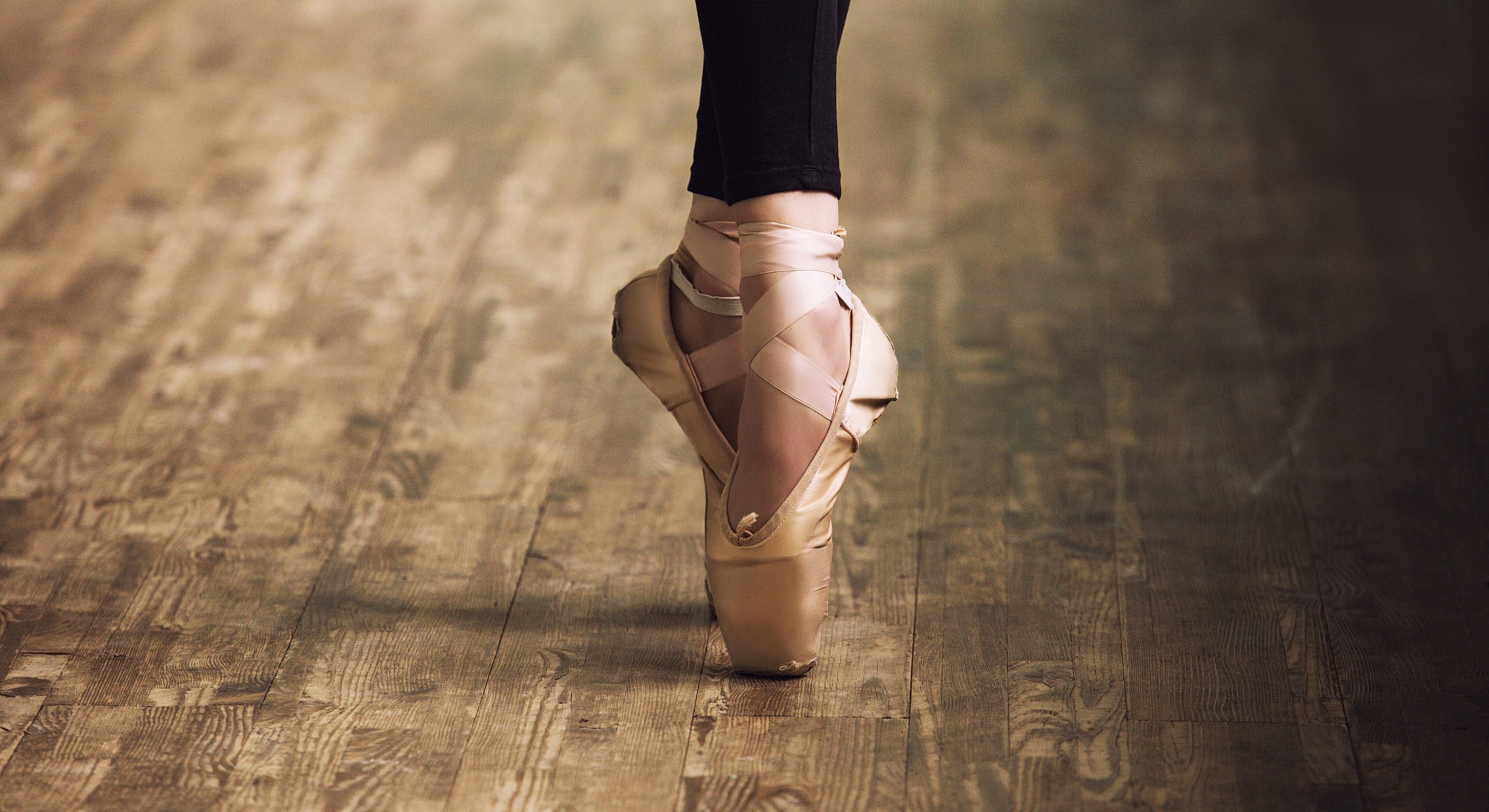 Blurry gym interior with wooden table foreground.